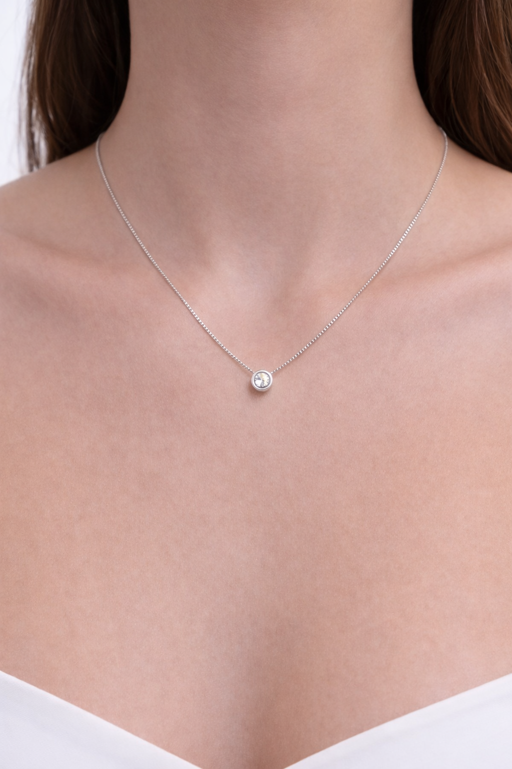 colgante con punto de luz de oro blanco