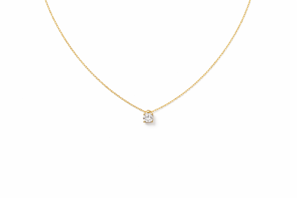 colgante de oro amarillo con punto de luz